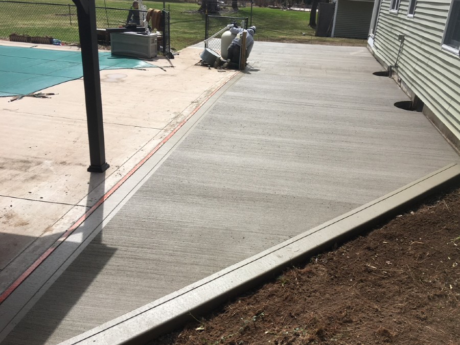 home concrete patio repair near syracuse ny image of workers using concrete on home patio