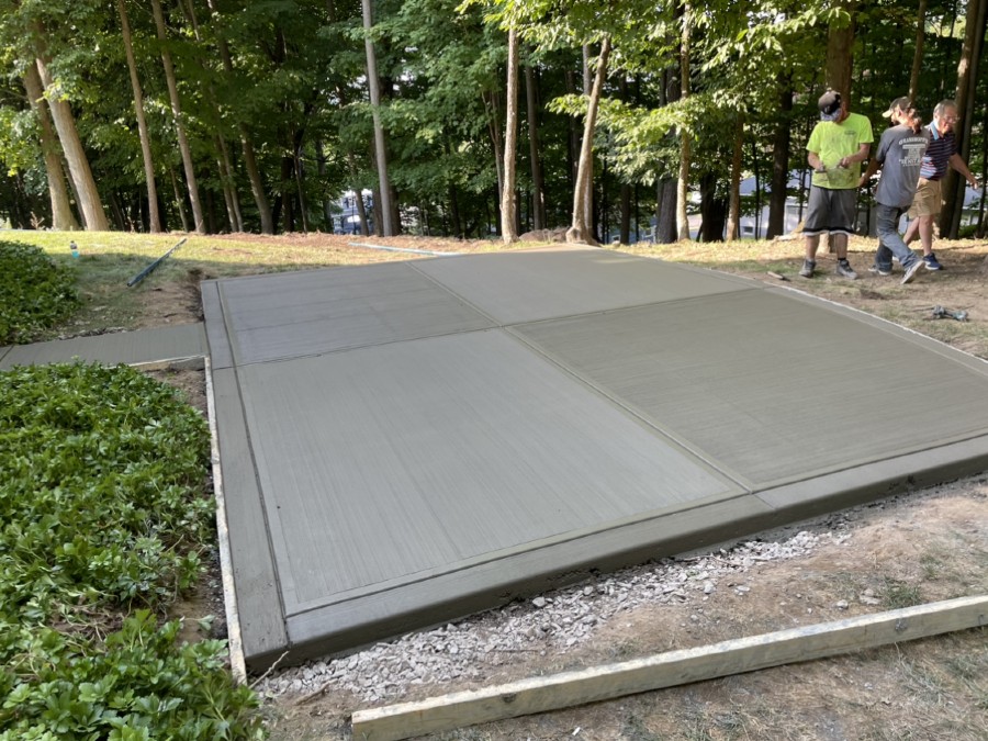 outdoor concrete patio repair near syracuse ny image of workers using concrete on outdoor patio slab